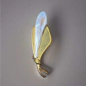 Elegant Gold and White Brooch